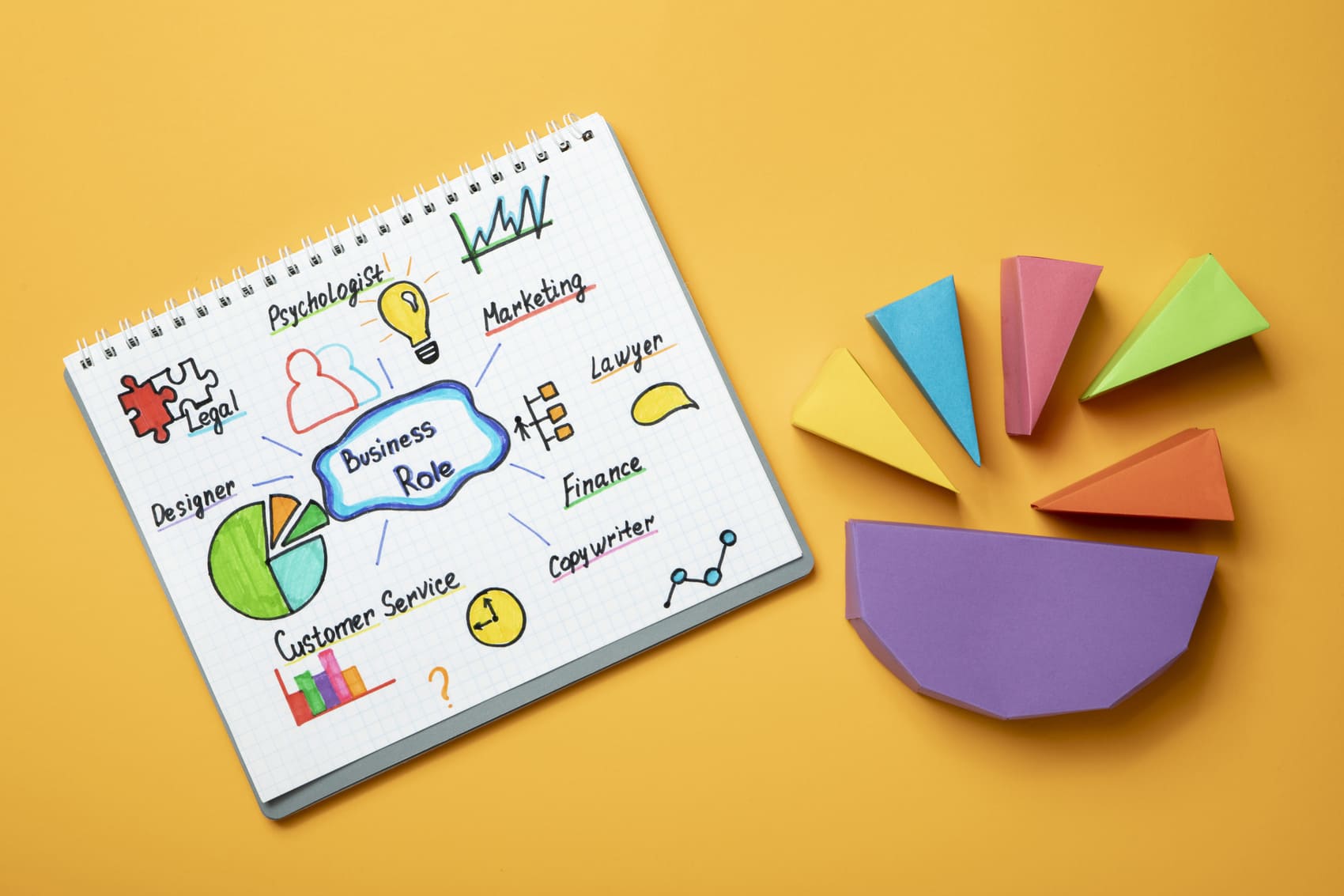 flat-lay-notebook-yellow-background
